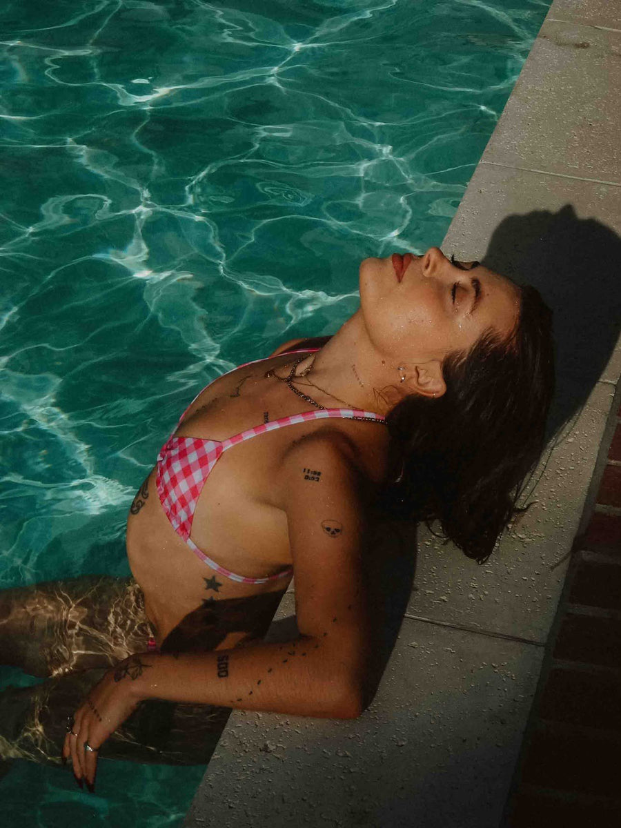 Customer photo: Hot Girl Picnic gingham bikini top, lying at the pool edge